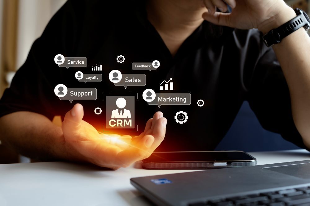 Business professional using CRM system for sales, marketing, and support.